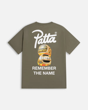 Back view of dusty olive Patta Championship t-shirt with championship rings graphic and script logo.